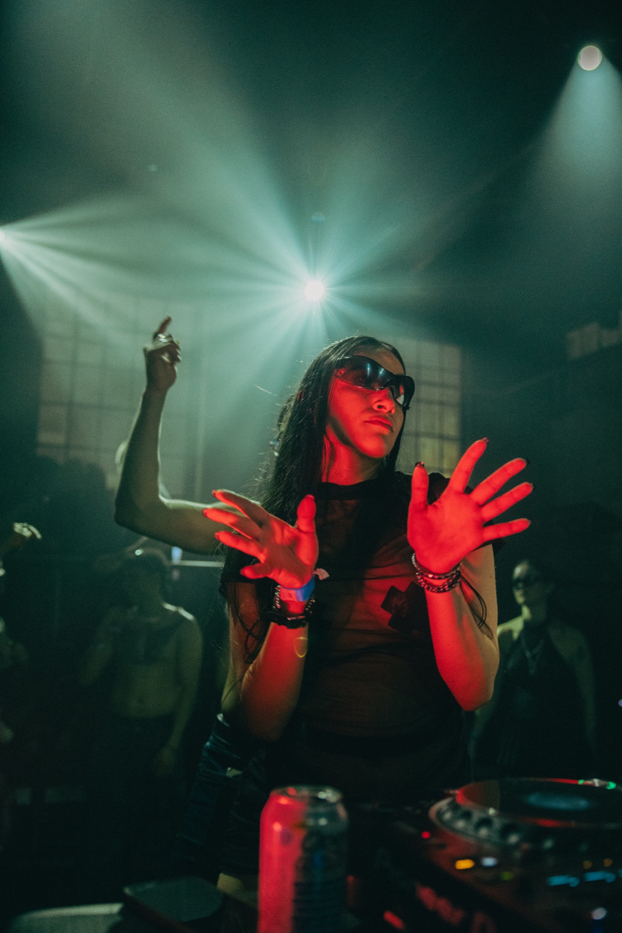 DJ under red and green lights